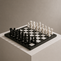 Black and white marble chess set on display pedestal — Stone & Game