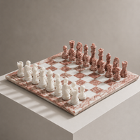 Pink and white marble chess set on display pedestal — Stone & Game