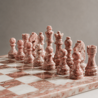 Close-up of pink marble chess pieces — Stone & Game