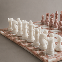 White marble chess pieces on pink board — Stone & Game
