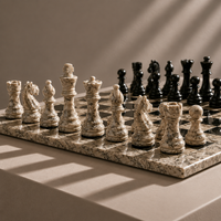 Close-up of black marble chess pieces on oceanic board — Stone & Game