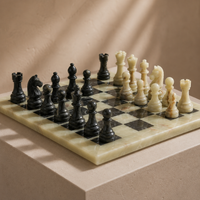 Green onyx marble chess board with black pieces detail — Stone & Game