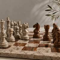Brown and cream marble chess knights face to face — Stone & Game