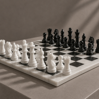 White marble chess pieces detail on black and white board — Stone & Game