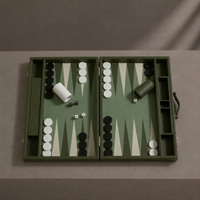 Green leather backgammon set side angle with pieces in play — Stone & Game