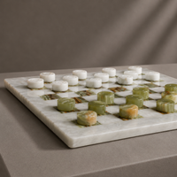 Green onyx and white marble checkers pieces close-up — Stone & Game