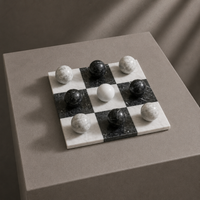 Black and white marble tic tac toe set on display — Stone & Game