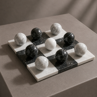 Black and white marble spheres close-up on tic tac toe board — Stone & Game