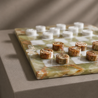 Onyx marble checkers pieces close-up with natural veining — Stone & Game