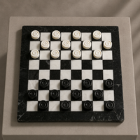 Black marble checkers pieces close-up on white board — Stone & Game