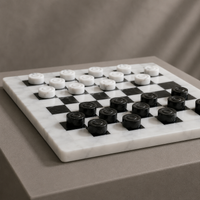 White marble checkers set side angle with black pieces — Stone & Game
