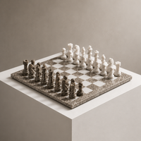 Grey and white marble chess set on display pedestal — Stone & Game