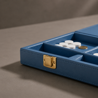 Gold hardware detail on blue leather backgammon case — Stone & Game