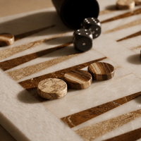 Brown and cream marble backgammon pieces close-up — Stone & Game