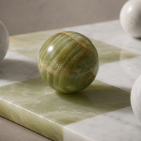 Green onyx marble sphere close-up detail — Stone & Game