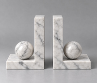 Pair of Carrara marble bookends with sculptural sphere detail – Stone & Gem