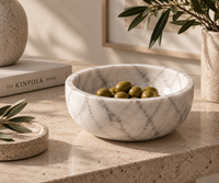 Carrara marble bowl on console table