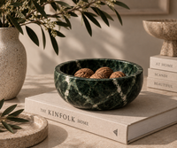 Green marble bowl on console table
