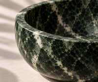 Green marble decorative bowl in modern interior