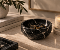 Black marble bowl on console table