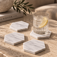 Carrara marble hexagon coaster close-up showing natural grey veining