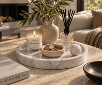 Round Carrara marble tray on console table