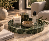 Round green marble tray styled with candles