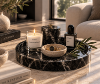 Round black marble tray on console table