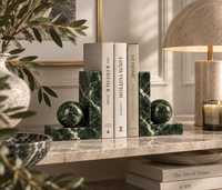 Green marble bookends styled on desk
