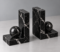 Black marble bookend close-up showing white veining