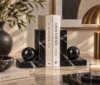 Black marble bookends styled on desk