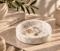 White marble catchall tray close-up showing grey veining