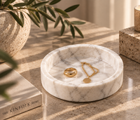 White marble catchall tray on bedside table