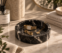 Black marble catchall tray on bedside table