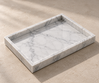 Carrara marble tray close-up showing natural grey veining