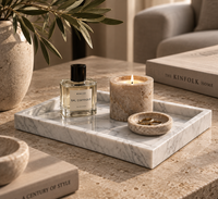 Carrara marble tray styled with perfume bottles on dressing table
