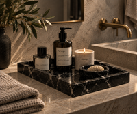 Black marble vanity tray on bathroom counter